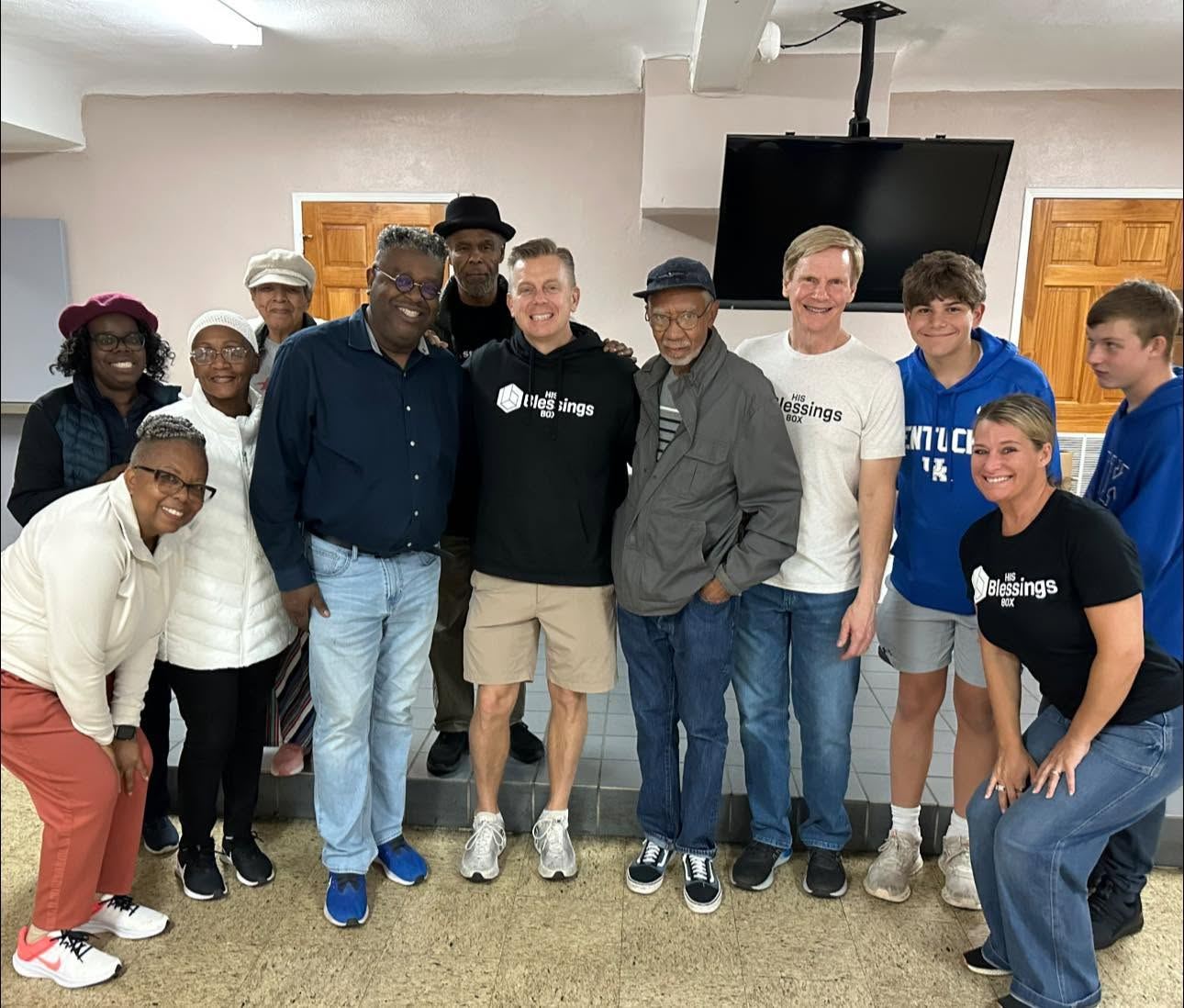 A large group of His Blessings Box volunteers gathered together after a serving shift