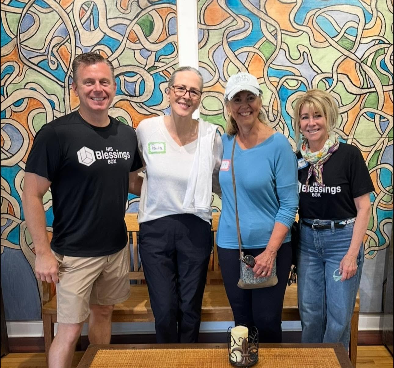 Five volunteers standing together before a serving shift