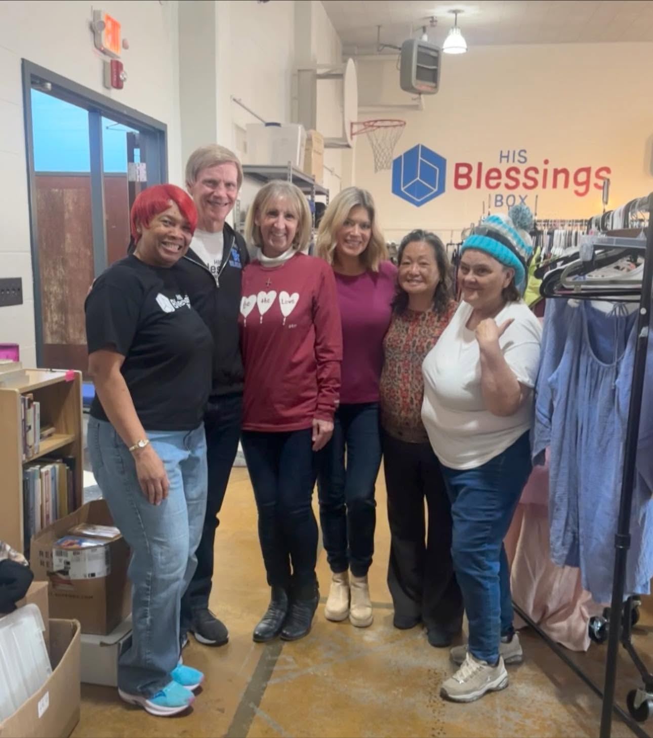 A group of volunteers in His Blessings Box shirts